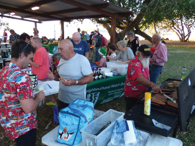 Community-members-including-our-hard-working-member-Bruce-Barnet-enjoying-the-free-sausage-sizzle_
